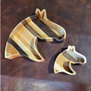 Two Acre Woodworks’ Wooden Horse Head Serving Trays, available in large and small sizes, feature alternating light and dark wood stripes and offer custom engraving options for a personalized touch.