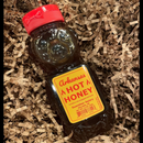 DDR BBQ Supply Guenther Apiary Arkansas Hot Honey in a bear-shaped squeeze bottle nestled in brown paper shred