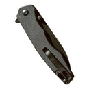 The Spaceman Knives Naiad EDC Pocket Knife by Spaceman Knives features a textured dark handle, metal pocket clip, and titanium-plated blade, shown closed against a white background.