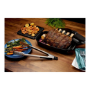 DDR BBQ Supply Napoleon PRO Series stainless steel grill tongs next to a roasted rack of ribs and grilled vegetables.