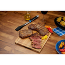 DDR BBQ Supply Napoleon silicone basting brush with black bristles and ergonomic handle resting on a wooden table.