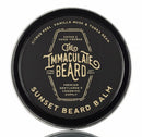 DDR BBQ Supply Immaculate Beard natural balm in a black tin with citrus, vanilla, and tonka bean scent profile.