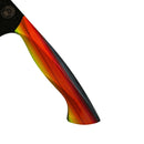 Close-up of the Spaceman Knives EM Wave Chef Knife handle by Spaceman Knives, featuring a vibrant striped design in red, orange, yellow, and black against a white background.