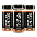 DDR BBQ Supply Redneck Lipstick 3-pack of smoky, sweet, and spicy BBQ seasoning rub in clear plastic bottles.