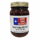 DDR BBQ Supply Salted Vodka Rib Glaze – 16 oz features a gold lid, Texas flag label, and offers a rich, dark rib sauce infused with vodka for bold flavor.