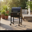 A Smokin Brothers "24" Premier Plus Pellet Grill is on a wooden deck, surrounded by potted plants and patio furniture in bright natural sunlight.