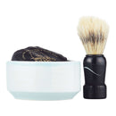 DDR BBQ Supply wet shaving kit with a ceramic bowl, wrapped soap puck, and a black-handled stiff fiber shaving brush.
