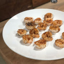 DDR BBQ Supply wood-fired seasoned shrimp on a white plate cooked in a WPPO Lava oven