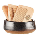 DDR BBQ Supply wooden beard combs with laser-engraved branding displayed in a rustic dark ceramic bowl