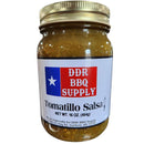 A pint glass jar of DDR BBQ Supply Tomatillo Salsa (Medium), 16 oz, with a gold lid. The label displays a Texas flag, product and brand names, salsa style, net weight (16 oz), and manufacturer info.