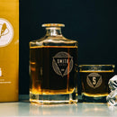 A square glass decanter and a matching custom engraved Whiskey Glasses: Modern, both featuring geometric logos.