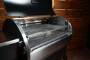 Recteq Deck Boss 590 pellet grill featuring a Pimp My Grill® Gen2 Slide-Out Rack System with two stainless steel cooking racks installed inside.