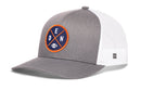 A black Haka Hat Denver Trucker Hat featuring a round DEN X football embroidered patch on the front, with blue, orange, and white accents and the letters DEN above a small football illustration.
