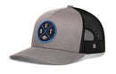Show off your Detroit football pride with the Haka Hat Detroit Football Trucker Hat | Black DET X Snapback. This gray and black trucker hat features a mesh back and a round blue patch on the front with the letters “D”, “E”, “T” and a football graphic—making it perfect for any fan. Stylish and comfortable, this Haka Hat snapback is an ideal Michigan hat for game days or everyday wear.
