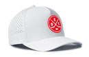 The Haka Hat Detroit Hockey Performance 5-Panel Hat | DET X Flexfit Snapback is a white performance snapback featuring a red circular logo with two crossed hockey sticks and the letters D E T on the front panel, delivering both style and comfort for Detroit hockey fans.