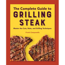 Paperback copy of The Complete Guide to Grilling Steak Cookbook: Master the Cuts, Rubs, and Grilling Techniques featuring two grilled steaks on the cover.