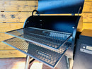 A Traeger Ironwood 885 with a Pimp My Grill® Gen2 Slide-Out Rack System installed, shown with its lid open and both racks pulled out.