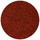 A close-up view of The Spice Lab Chile de Arbol Powder, finely ground and spread evenly in a circular shape against a white background—the perfect bulk foodservice ingredient for adding the fiery kick of this premium spice to your favorite dishes.