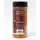 A clear plastic spice jar with a black lid, from Chiles and Smoke, displays nutrition facts and ingredients on its back label. The seasoning blend inside, Chiles & Smoke Sedona Sand Fiesta Seasoning, is red-orange in color and features spices like paprika, guajillo chili, and dehydrated garlic. This Southwest BBQ-inspired blend works as an all-purpose grilling seasoning—perfect for adding bold, smoky flavor to your favorite dishes.