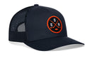 Haka Hat Edmonton Hockey Trucker Hat | EDM X snapback featuring a navy blue design with a circular patch showing two crossed hockey sticks and the letters E, D, and M in orange and white.
