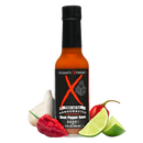 A bottle of Elijah’s Xtreme Ghost Pepper Hot Sauce by Elijah’s Xtreme (packing a potent 450,000 Scoville Heat Units) is shown next to a garlic bulb, a red pepper, a green jalapeño, and fresh lime wedges.