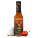 A bottle of Elijah's Xtreme Sins of the Father (Garlic Habanero) hot sauce from Elijah's Xtreme is pictured alongside a whole garlic bulb and an orange habanero pepper, making it the perfect garlic habanero hot sauce and an official collectible for Yellowstone fans and spice enthusiasts.