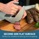 A person slices cooked steak with a large, uniquely shaped kitchen knife on the NULU Signature Cutting Board by NULU Inc. Text below reads: SECOND SIDE FLAT SURFACE. Perfect for traditional slicing and chopping.
