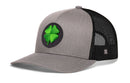 The Haka Hat Four Leaf Clover Trucker Hat by Haka Hat features a gray and black mesh design with a green four-leaf clover patch on the front, making this St. Patrick’s Day snapback perfect for adding lucky flair to any outfit.
