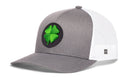 Show off your St. Patrick’s Day spirit with the Haka Hat Four Leaf Clover Trucker Hat by Haka Hat—a stylish gray and white mesh snapback featuring a green four-leaf clover patch on the front, perfect for casual holiday celebrations.