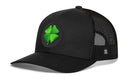 The Haka Hat Four Leaf Clover Trucker Hat by Haka Hat features a black design with a breathable mesh back and a round front patch showcasing a green four-leaf clover—making it the perfect St. Patrick’s Day snapback or an everyday lucky clover hat.