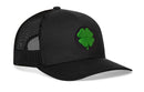 The Haka Hat Four Leaf Clover Trucker Hat by Haka Hat is a black mesh snapback that showcases a bold green four-leaf clover patch on the front panel—making it the perfect St. Patrick’s Day accessory or an everyday way to add a bit of luck to your style.