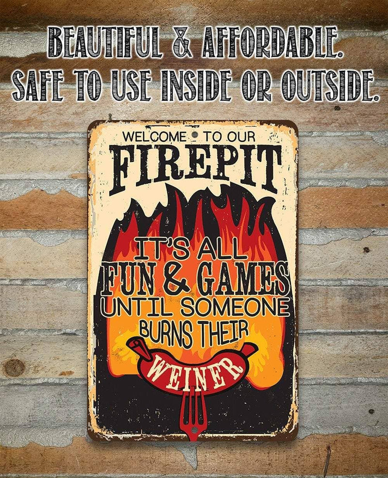Metal sign with humorous firepit warning on a wooden background