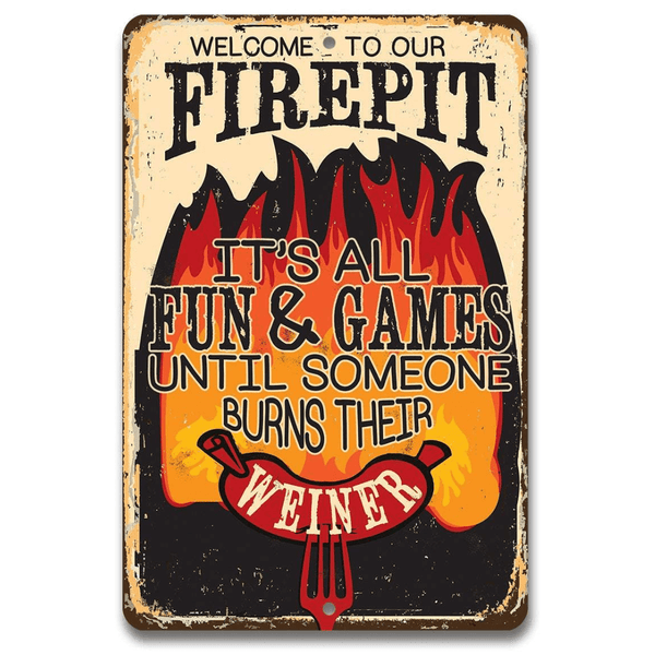 Metal sign with humorous text about a firepit and a burning your Weiner with a hot dog, on a white background.