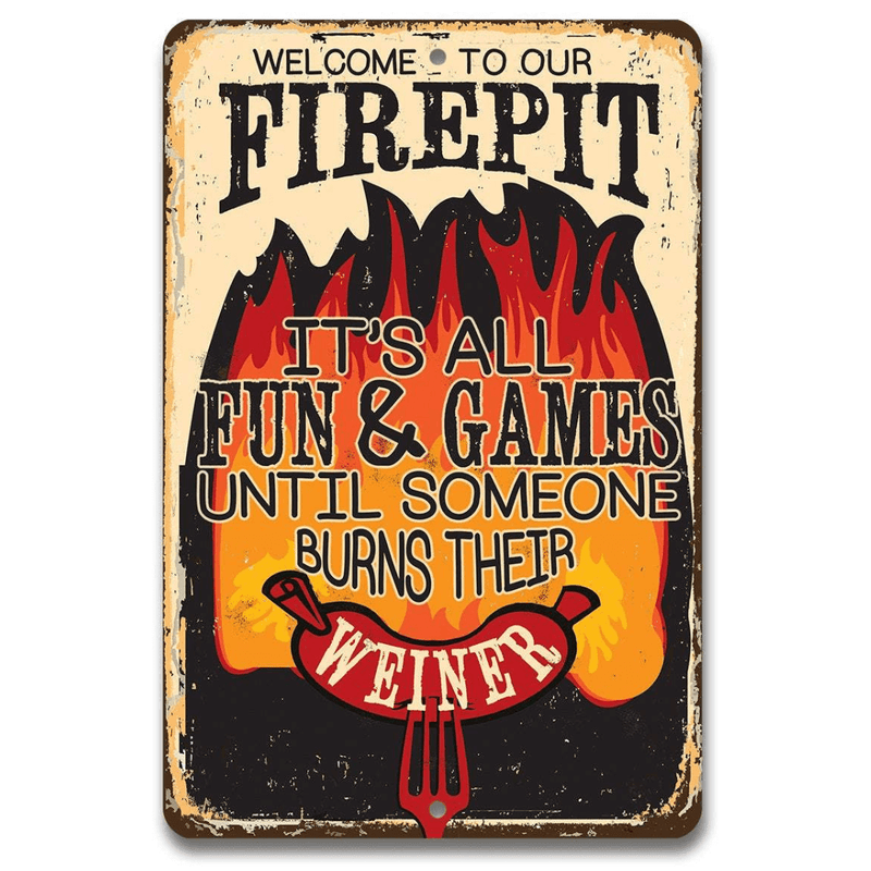 Metal sign with humorous text about a firepit and a burning your Weiner with a hot dog, on a white background.