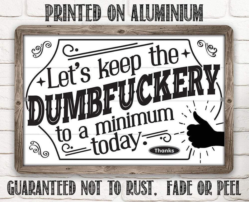 Decorative sign with humorous text and wooden frame on a white brick wall background.