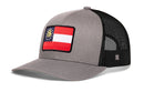 Gray and black Haka Hat Georgia Flag Trucker Hat featuring a state flag patch on the front.