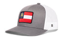 Haka Hat Georgia Flag Trucker Hat in grey and white mesh featuring a state flag patch on the front.