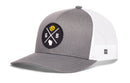 Show off your Wisconsin pride with the Haka Hat Green Bay Trucker Hat | Black GB Cheese X Snapback by Haka Hat. This stylish gray and white trucker hat features a breathable mesh back, snapback closure, and a round black patch on the front displaying a lion, crossed lines, the letters G and B, and an outline of Wisconsin.