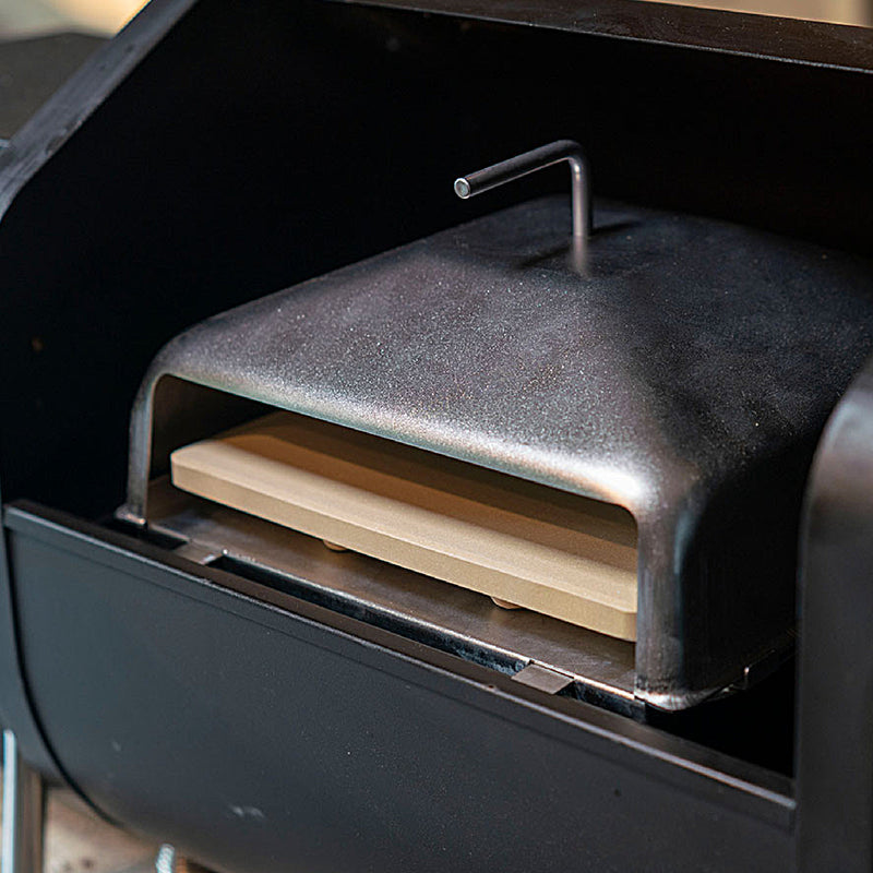 Green Mountain Grill Pizza Oven accessory for Trek pellet grill shown in grill from the side. 