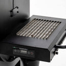 Green Mountain Grills Sideburn Side Burner for Ledge/Peak 2.0 shown on side of pellet grill. 