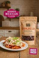 A plate of chilaquiles topped with cheese and cilantro sits beside a bag of Rico Rico Guajillo Dried Chiles – Authentic Medium Heat Mexican Peppers in a kitchen, perfect for creating genuine Mexican cuisine. Text reads “Authentic Mexican Flavor” and “Medium Heat,” showcasing the rich taste of Rico Rico peppers.