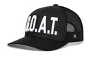 The Haka Hat G.O.A.T. Trucker Hat is a black mesh snapback featuring bold white GOAT embroidery, a curved brim, structured front panels, and an adjustable closure for comfort.
