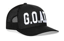 The Haka Hat G.O.A.T. Trucker Hat is a black mesh snapback featuring bold white GOAT embroidery on the front and an adjustable closure for a perfect fit.