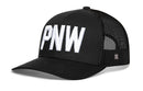 The Haka Hat PNW Trucker Hat is a black snapback featuring bold 3D white embroidery, a mesh back, and an adjustable closure for the perfect fit.