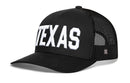 The Haka Hat Texas Trucker Hat is a black snapback featuring bold 3D embroidered white "TEXAS" lettering across the front and a small logo on the mesh side panel.