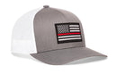 The Haka Hat Thin Red Line Trucker Hat by Haka Hat is a gray and white fire snapback featuring a patch of a black, white, and gray American flag with a single red stripe, honoring firefighters.