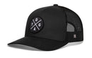 The Haka Hat YOGA Trucker Hat in black is a fitness snapback featuring a mesh back and a round front patch with crossed lines and the letters Y, O, G, and A.