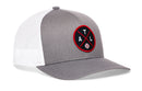 The Haka Hat Atlanta Trucker Hat is a gray and white mesh snapback featuring a round black patch with red trim, crossed lines, “A,” “T,” “L,” and a small baseball. Brand: Haka Hat. Product: ATL X Baseball Snapback.