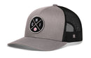 The Haka Hat Chicago Trucker Hat is a silver snapback featuring a black mesh back and a circular CHI X Baseball patch—a classic look from Haka Hat.