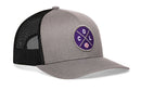 The Haka Hat Colorado Trucker Hat | COL X Baseball Snapback features a gray and black design with a black mesh back and a round purple front patch—ideal for showing Denver Colorado pride.
